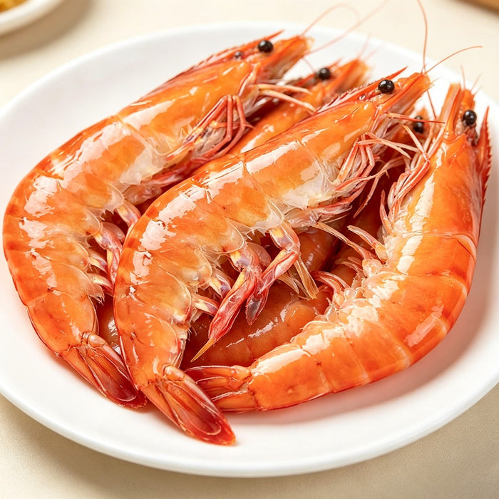 Plump cooked prawns on a white plate